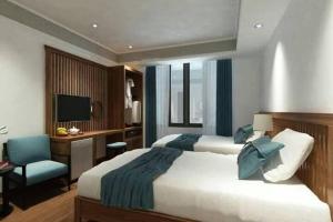 Postelja oz. postelje v sobi nastanitve Tam Coc Condelux Boutique Hotel & Travel