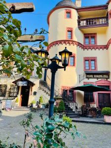 a street light in front of a building at Hotel Schloss Zell in Zell an der Mosel