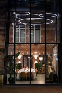 a dining room with a table in a building at Pestana Amsterdam Riverside in Amsterdam