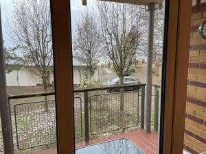 a view from a window of a porch with a fence at Seeblick Wohnung 216 mit Ostseeblick in Ostseebad Koserow