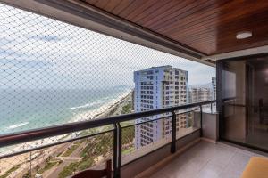 a balcony with a view of a city at Vista Panoramica da Praia com 2qts, e vaga in Rio de Janeiro