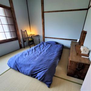 Nogataの商店街の一角にあるちいさな隠れ家　忘覚庵にあるベッド