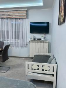 TV a/nebo společenská místnost v ubytování Belien Apartman