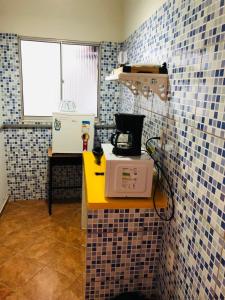 Kuchyň nebo kuchyňský kout v ubytování Tamboleiros Hotel & Hostel