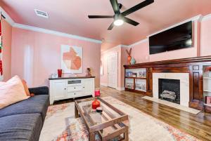 a living room with a couch and a fireplace at Strawberry Lodge - City card 4 local business in Oklahoma City