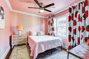 a small bedroom with a bed and a window at Strawberry Lodge - City card 4 local business in Oklahoma City