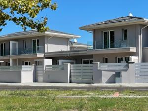 a large house with a fence in front of it at Polinesia 1 in Lido delle Nazioni