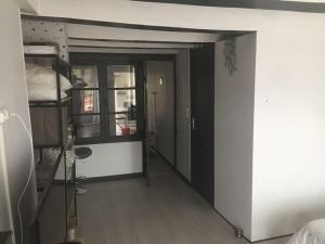 a room with a room with a bunk bed and a hallway at Très jolie appartement in Aiguilhe