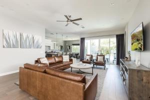 a living room with a couch and a table at Camelback Dwelling - Private Pool/Spa - In Old Town in Scottsdale