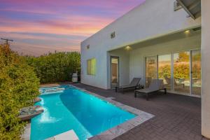 a swimming pool in the backyard of a house at Camelback Dwelling - Private Pool/Spa - In Old Town in Scottsdale