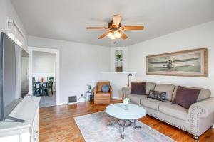 a living room with a couch and a table at Downtown Billings Retreat Close to Shops and Eats! in Billings