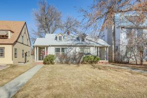 a white house with a yard at Downtown Billings Retreat Close to Shops and Eats! in Billings