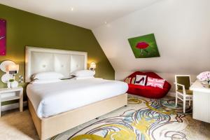 a bedroom with a white bed and a green wall at The Daffodil Hotel & Spa in Grasmere