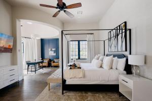 a bedroom with a bed and a ceiling fan at Luxe Poolside Paradise - Resort Style Yard in Scottsdale