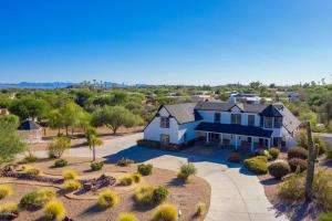 an aerial view of a house with a driveway at Majestic Mountain Mansion - Camelback Views! in Scottsdale