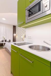 Kuchnia lub aneks kuchenny w obiekcie limehome Graz - Argos by Zaha Hadid