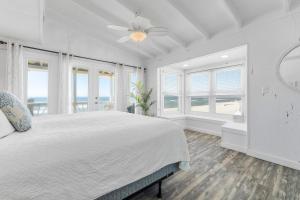 En eller flere senge i et værelse på Bama Breeze