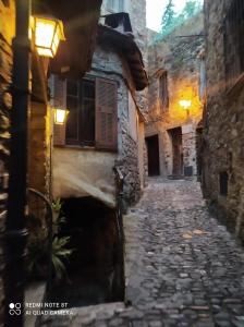 an alley in an old town at night at B&B Da Marta in Apricale