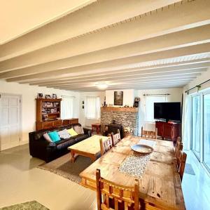 a living room with a table and a couch at Fertha View in Cahersiveen