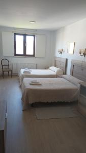 Posteľ alebo postele v izbe v ubytovaní Hostal padornelo