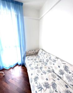 a bed in a room with a large window at Da Elsa in Chioggia
