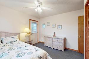a bedroom with a bed and a ceiling fan at The Beacon 95 in Avon