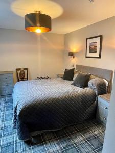 a bedroom with a large bed in a room at Beaufort Hotel in Inverness