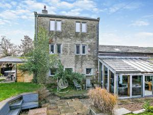 an old brick house with a garden in front of it at 6 Bed in Slaithwaite 93984 in Huddersfield