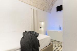 A bed or beds in a room at La Dimora del Tempo by Wonderful Italy