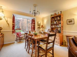 a dining room with a table and chairs at 3 Bed in Portinscale 93949 in Portinscale +7 photos