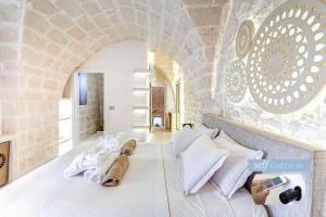 Postel nebo postele na pokoji v ubytování Vico Bianco Raro Smart Rooms Collection