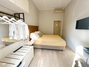 Postel nebo postele na pokoji v ubytování Hotel Giappone