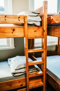 a stack of bunk beds in a room at Denton House Hostel in Keswick
