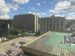a large pool on the roof of a parking lot at Suite HotelCCT in Caracas
