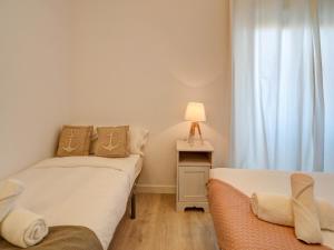 Posteľ alebo postele v izbe v ubytovaní Clarimar Duplex by Hello Homes Sitges