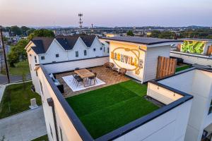an aerial view of a house with a backyard at QuadHouse - 4 Luxe Homes - 4 Private Rooftops in Nashville