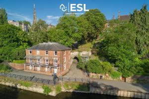 an aerial view of a building next to a river at 3 Bedroom House - Overlooking River - Shrewsbury Town Centre in Shrewsbury