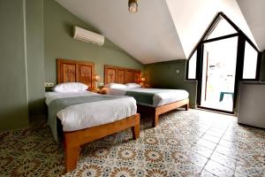 Säng eller sängar i ett rum på Adakale Butik