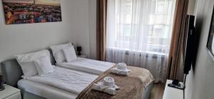 Łóżko lub łóżka w pokoju w obiekcie Apartament Rynek 40m2 Wrocław Stare Miasto