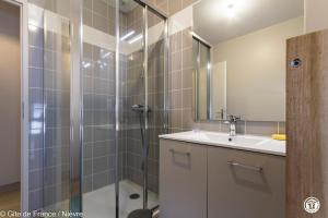 a bathroom with a shower and a sink at Le gîte de la poste in Onlay +15 photos