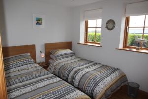 מיטה או מיטות בחדר ב-Sandbar