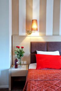 A bed or beds in a room at Anastassiou Hotel - Bike and motorcycle friendly hotel