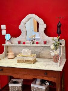 a bathroom counter with a sink and a mirror at Lacanepière in Générac
