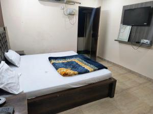 A bed or beds in a room at Galaxy Inn Hotel