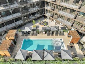 an aerial view of a building with a swimming pool at Nashville - 635 7th Ave S Unit 611 in Nashville