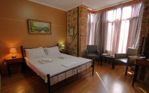 A bed or beds in a room at Ionia rooms
