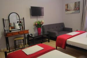 A bed or beds in a room at Ionia rooms