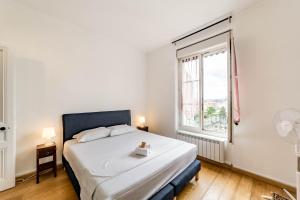 Ένα ή περισσότερα κρεβάτια σε δωμάτιο στο Grand appartement lumineux 2-4 personnes