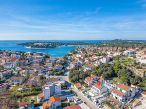 an aerial view of a city and the ocean at Villa Incanto in Pješčana Uvala 