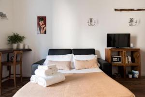 Postel nebo postele na pokoji v ubytování Agora Apartments - Armida